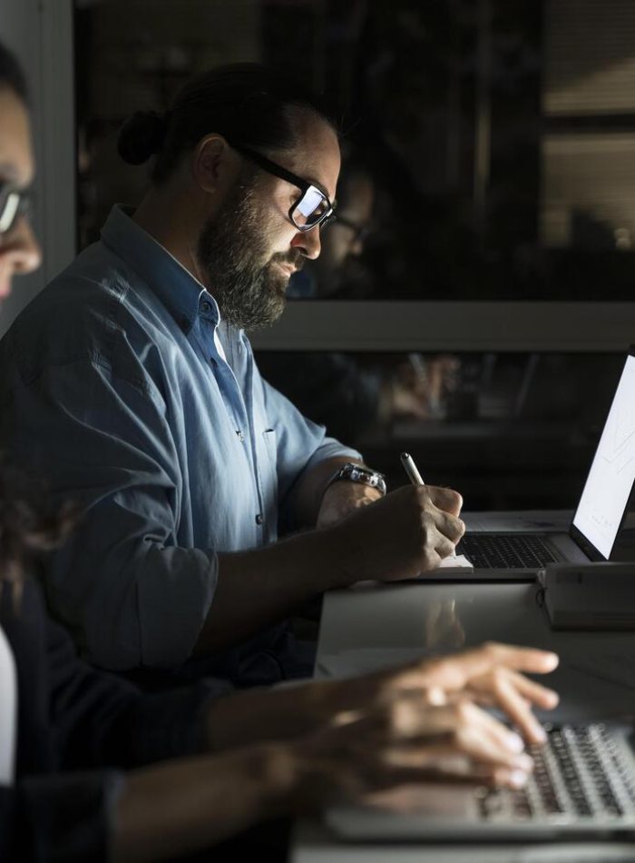 business-teammates-working-late-office